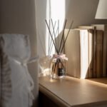 Velvet Rose -100ml Fragranced Octagonal Diffuser with a pink ribbon, on a window seal in sunshine