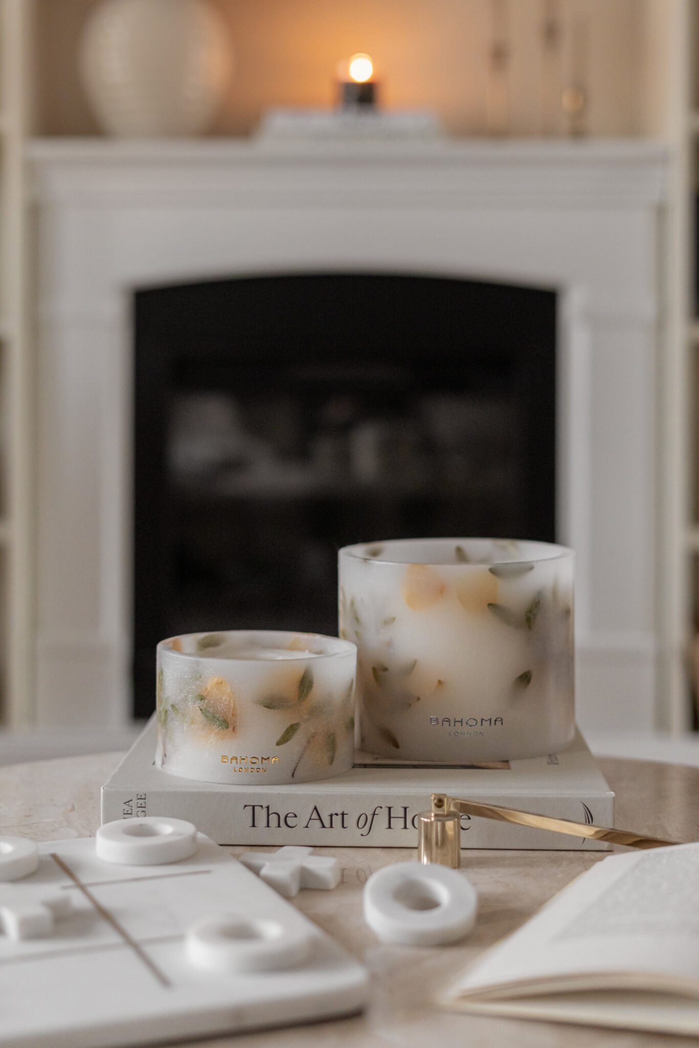 Comparison of the Amalfi Coast Scented Grand Pillar Candle and the Small Pillar side by side. Candles being lit with a long match.