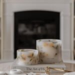 Comparison of the Amalfi Coast Scented Grand Pillar Candle and the Small Pillar side by side. Candles being lit with a long match.