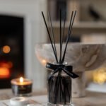Bahoma Obsidian Collection 100ml fragranced octagonal diffuser with black liquid and black reeds styled on a table in a warm modern interior