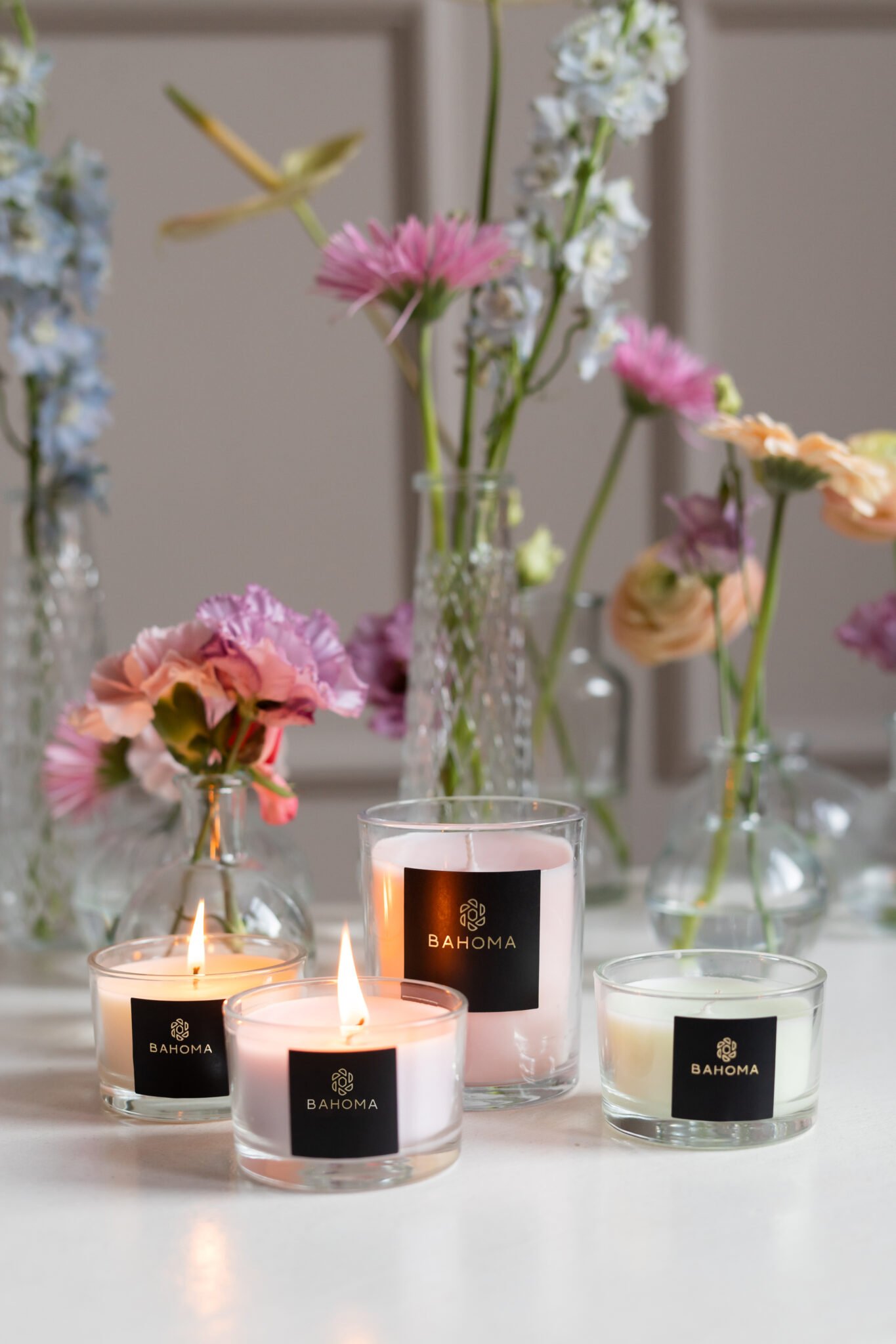 Wild Heather & Oakwood - Set of 3 Compact Candles in Gift box. Image showing a selection of compact candles in lifestyle setting.