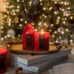 Striking red candle in octagonal design vessel