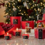 Red candles and fragranced diffusers in Christmas festive fragrance
