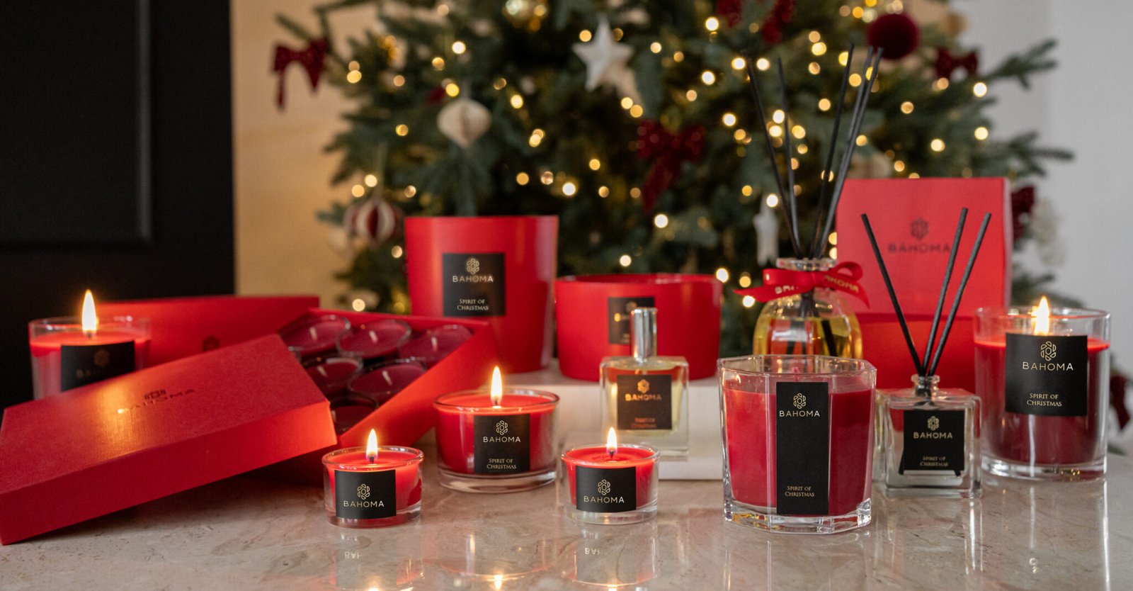 Red candles and fragranced diffusers in Christmas festive fragrance