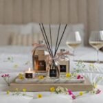 500ml Fragranced Octagonal Diffuser in a gift box - Le Jardin - All three sizes of octagonal diffusers arranged on a tray with a bed in a background